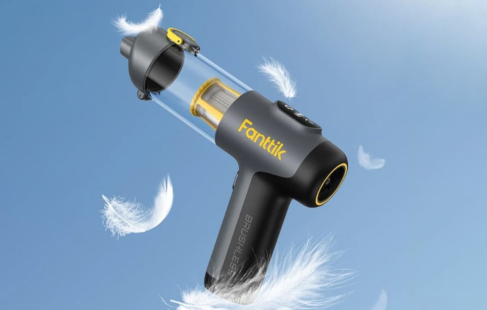 Fanttik portable car vacuum cleaner on blue background with white feathers.