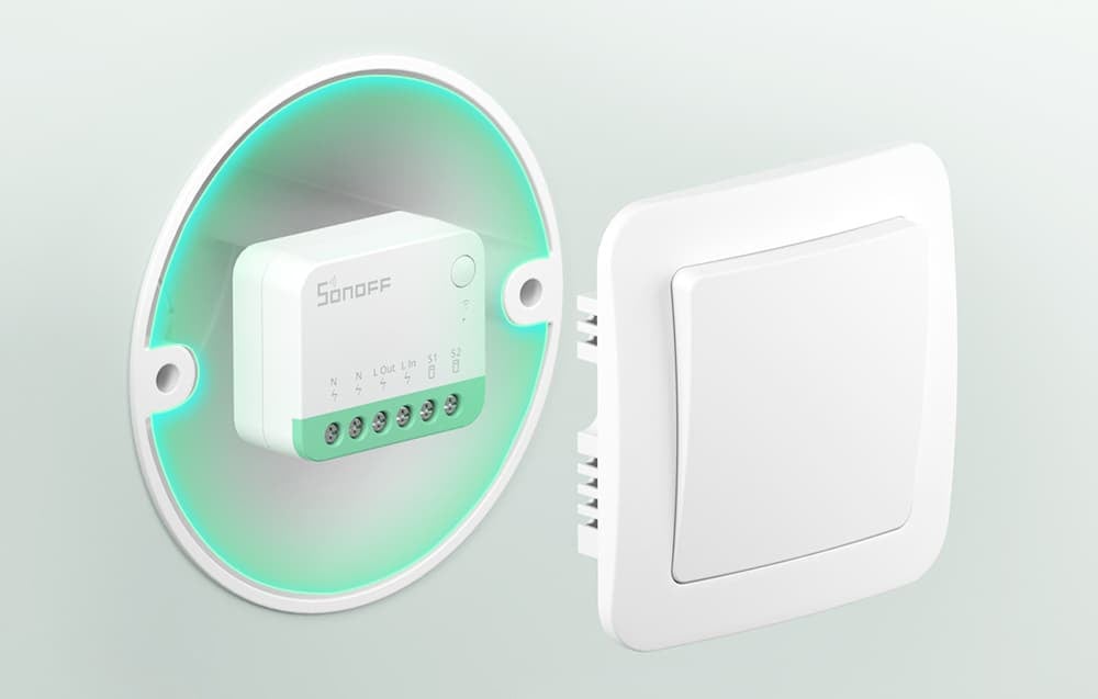 Sonoff Mini Extreme module mounted in an installation box with a visible cover in the form of a switch