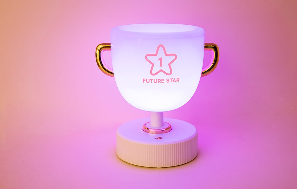 SuperFire W-006 Champion Light children's night light on a pink background.
