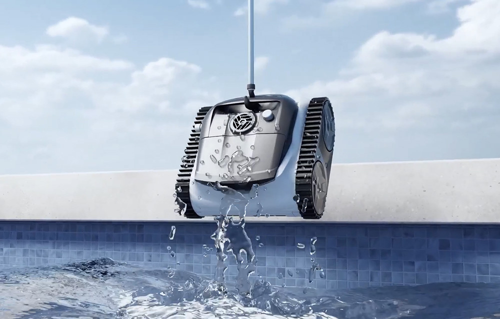 Pool cleaning robot being pulled out of the water