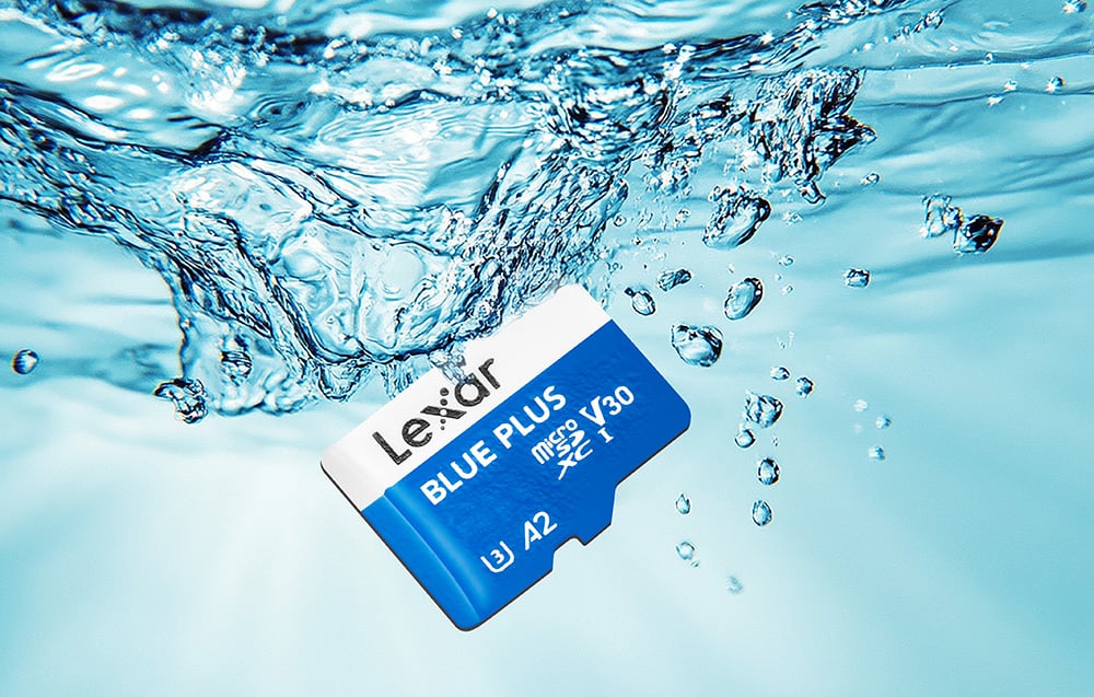Lexar Blue Plus microSDXC memory card submerged in clear water with air bubbles, symbolizing the product's water resistance and durability.