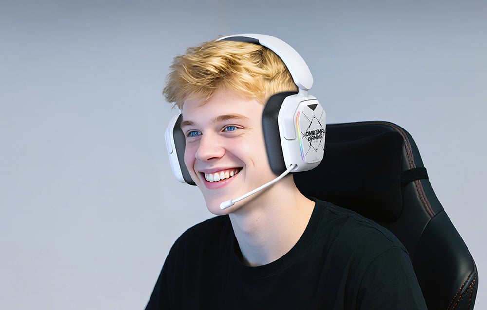 Smiling blond man in white gaming headphones