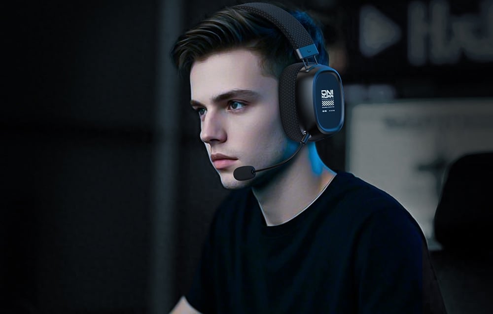 Young man in black t-shirt wearing gaming headphones with microphone