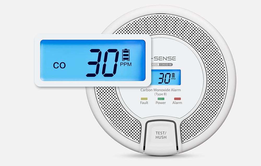 Detektor CO z powiększonym niebieskim wyświetlaczem pokazującym 30 PPM