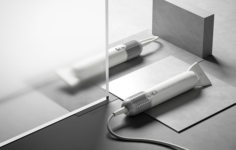Two white dryers lie on gray geometric surfaces in a minimalist arrangement