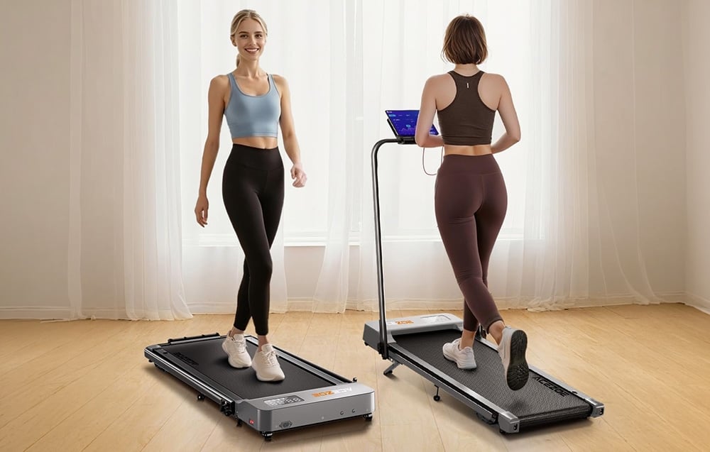 2 women on a treadmill in a bright room