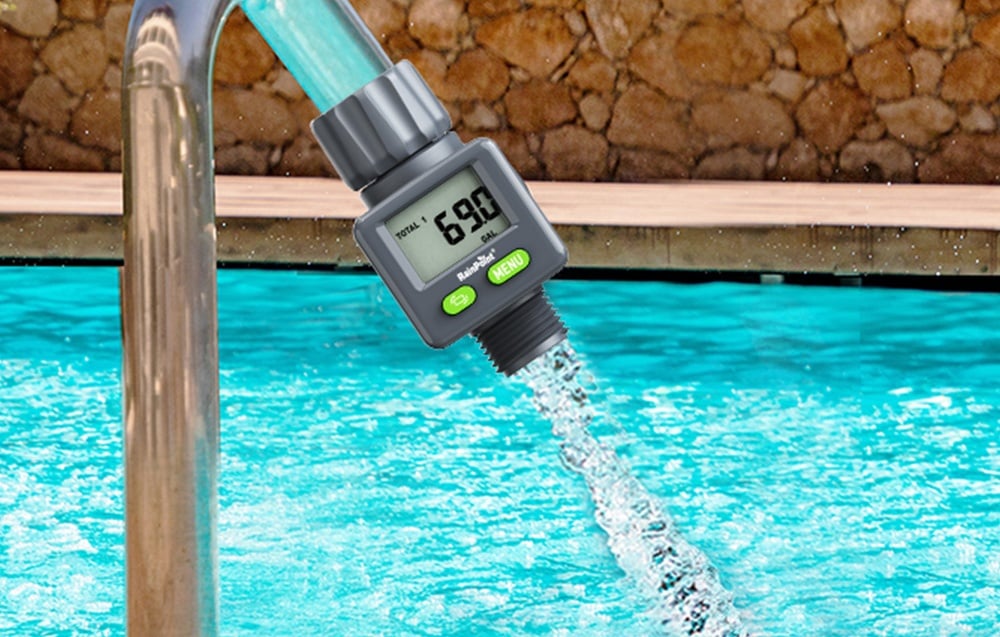 RainPoint flow meter installed on the pool filling hose, with water flow visible.