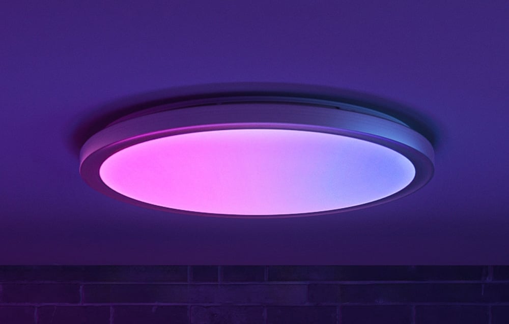 Close-up of the Yeelight Jupiter D C600 lamp emitting pink and blue light.