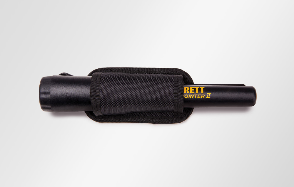 Garrett Pro-Pointer II metal detector in a black holster against a light background.