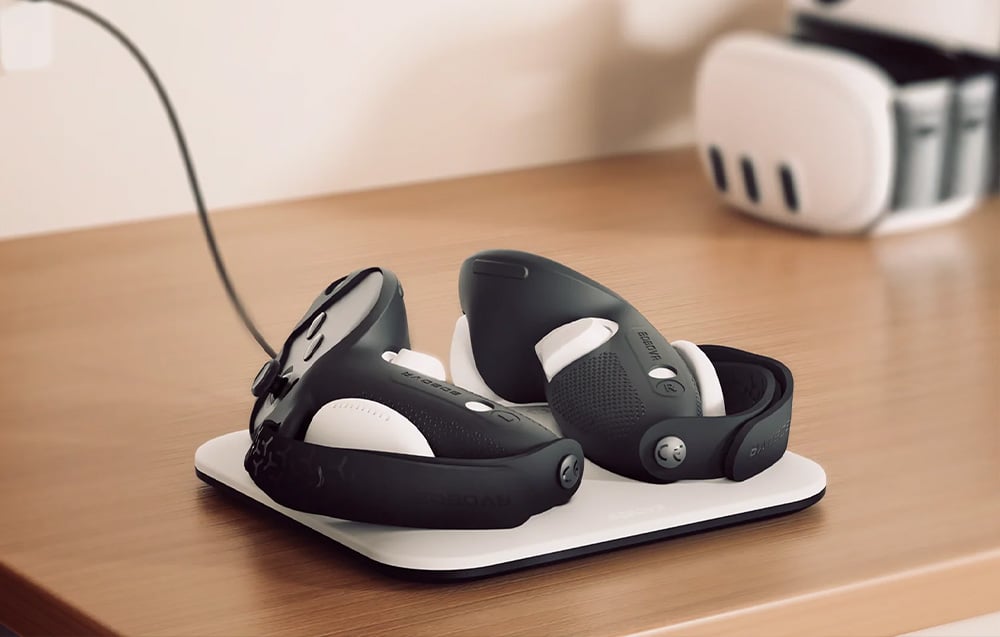 BoboVR CD3 station with two VR controllers charging via cable on a wooden tabletop