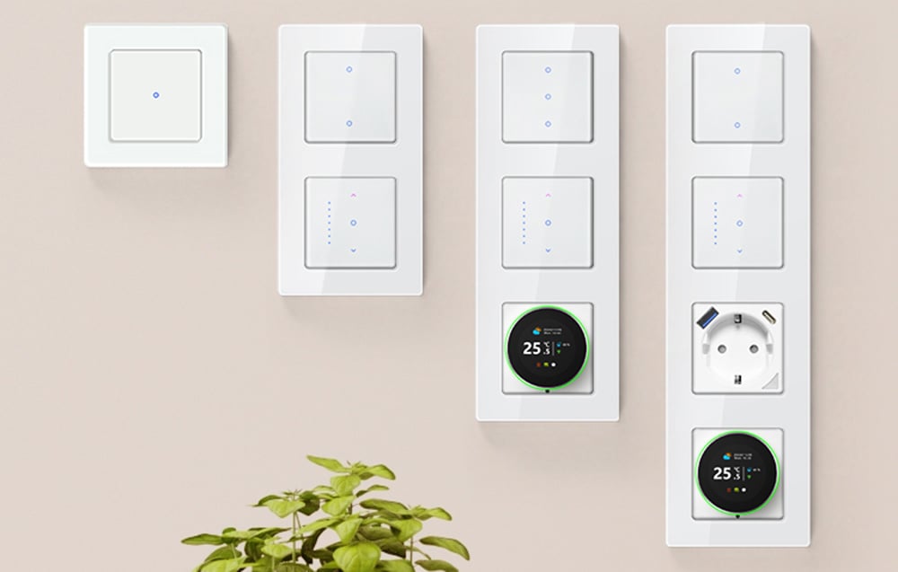 Touch light switches, outlet and thermostats on bright wall