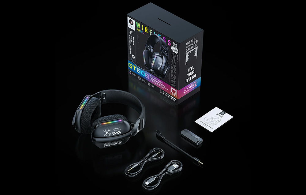 Onikuma headphones, USB and audio cables, user manual and box lying on a black background