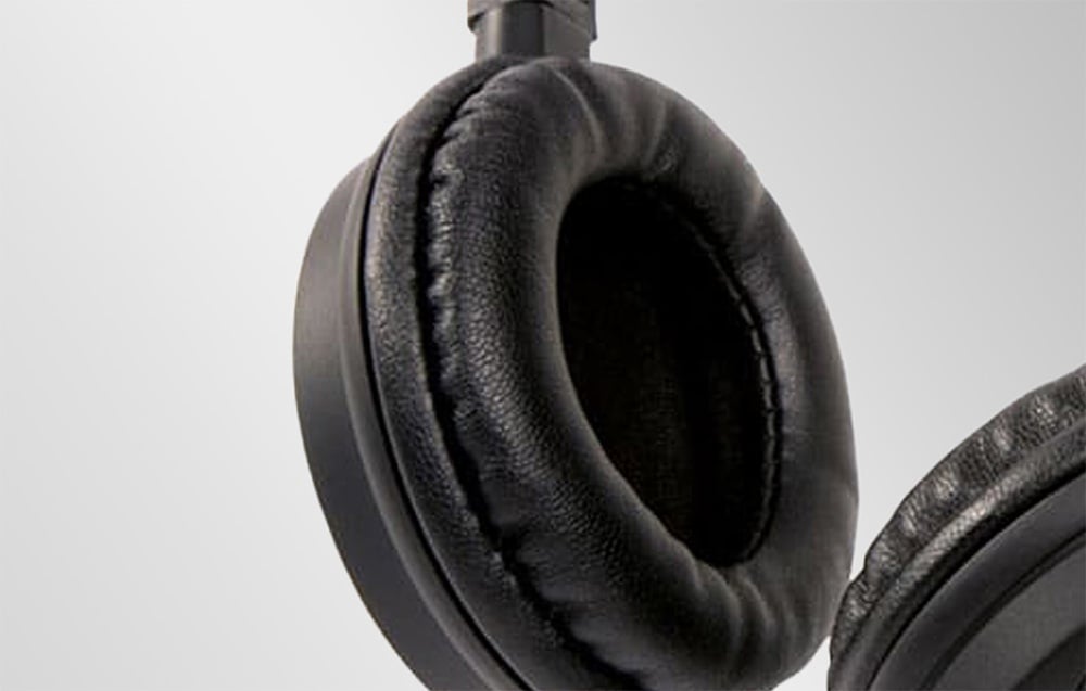 Close-up of the soft earpad made of black leather-textured material.