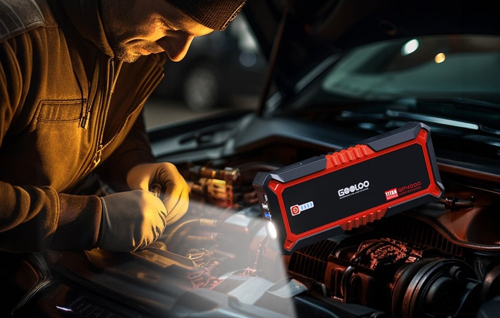 A person working on a car engine illuminated by the starter with the flashlight turned on