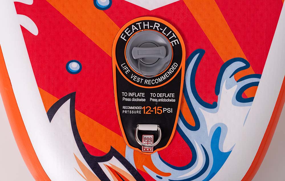 Close-up of the valve on a red surfboard