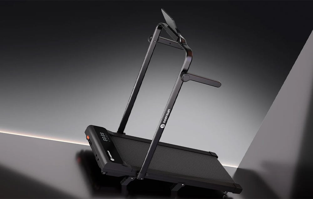 Black DeerRun treadmill with vertical tablet stand photographed against a dark studio background
