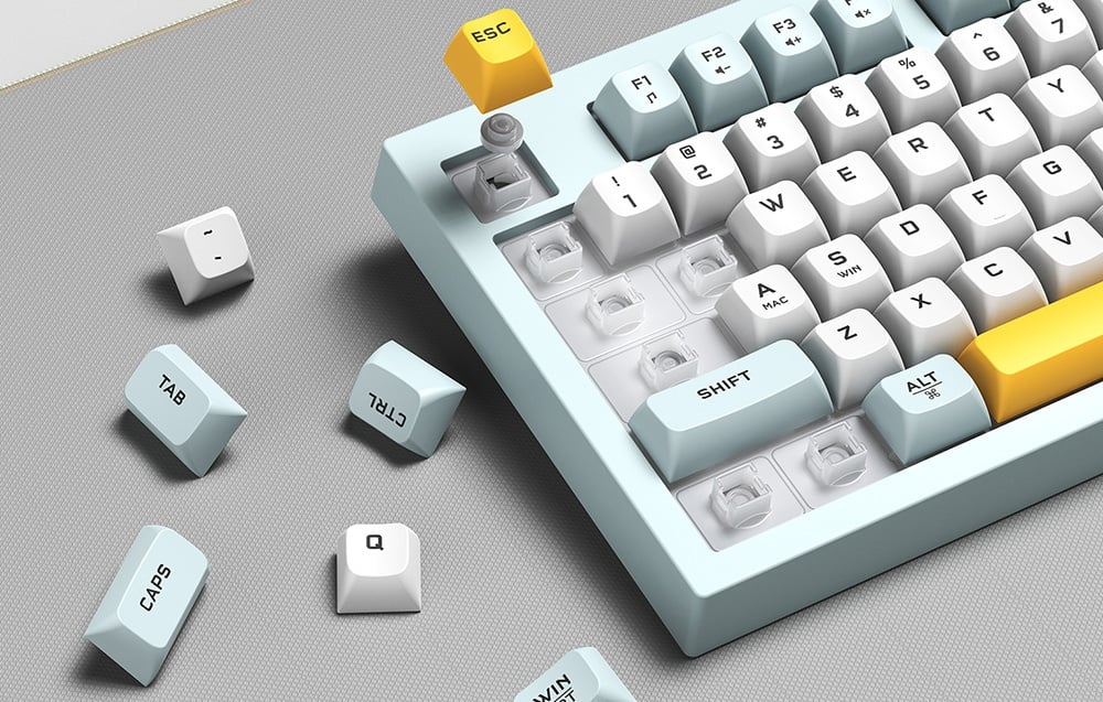Keyboard with keys removed showing mechanical switches and loose keys