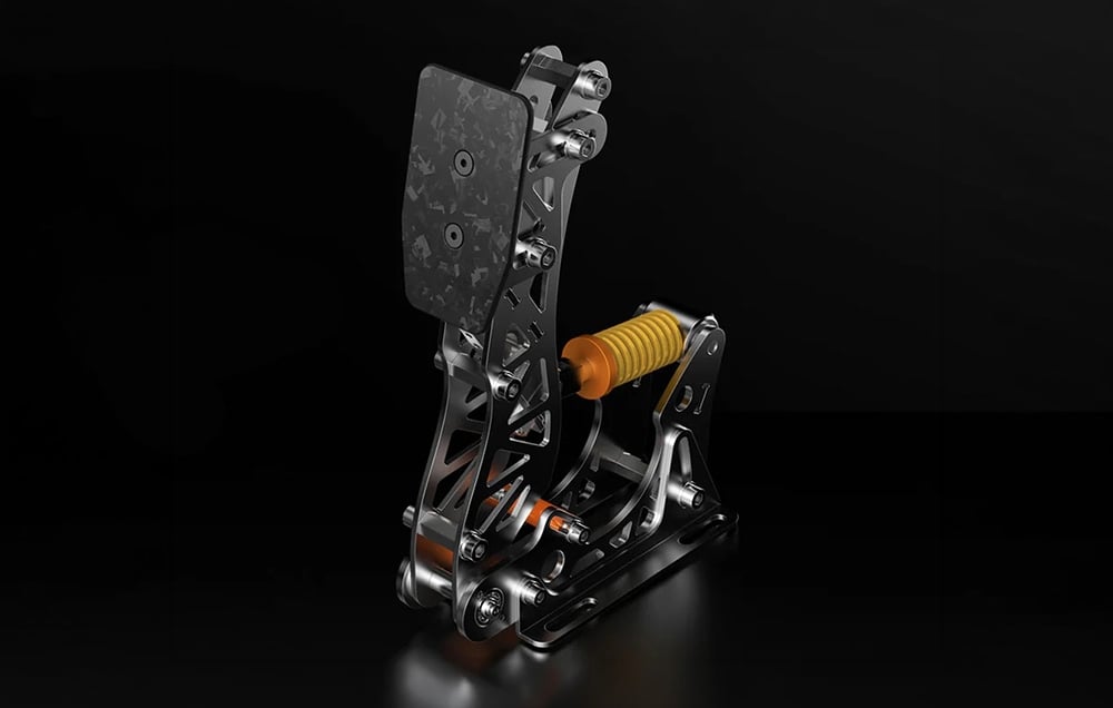 PXN single metal racing pedal with a carbon fiber cap and a yellow spring on a black background