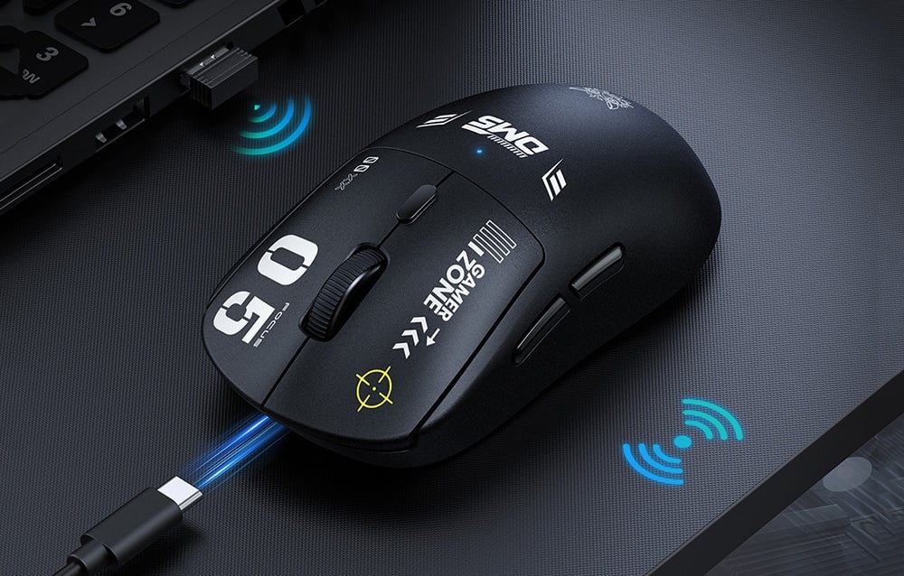 Onikuma DM05 black computer mouse with a USB-C cable on a desk next to a laptop