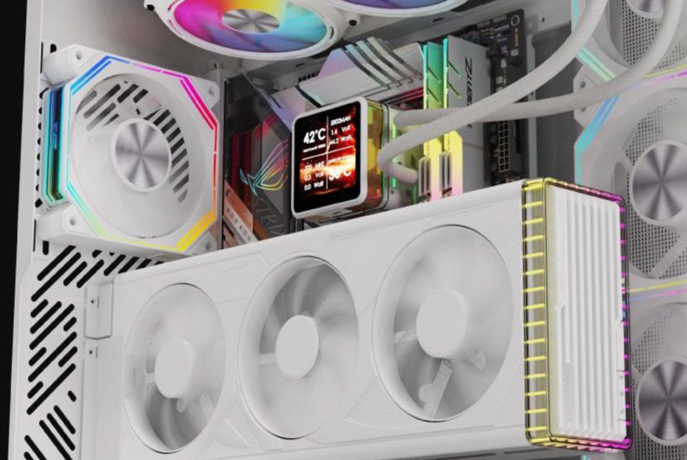 Interior of white computer case with colored RGB fans, temperature display and RAMs