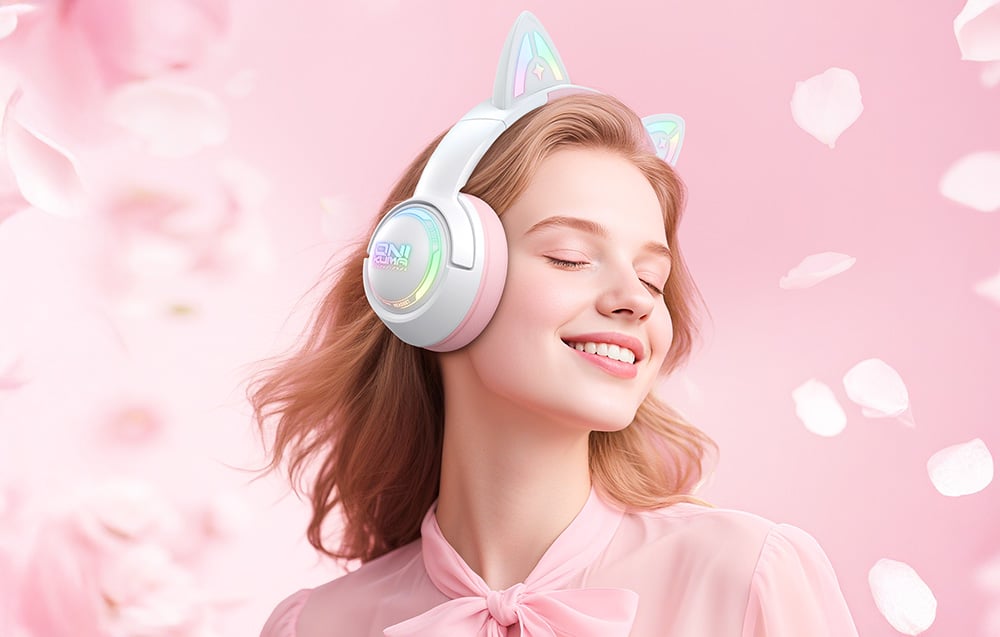Woman with red hair wearing Onikuma headphones, there are flower petals all around