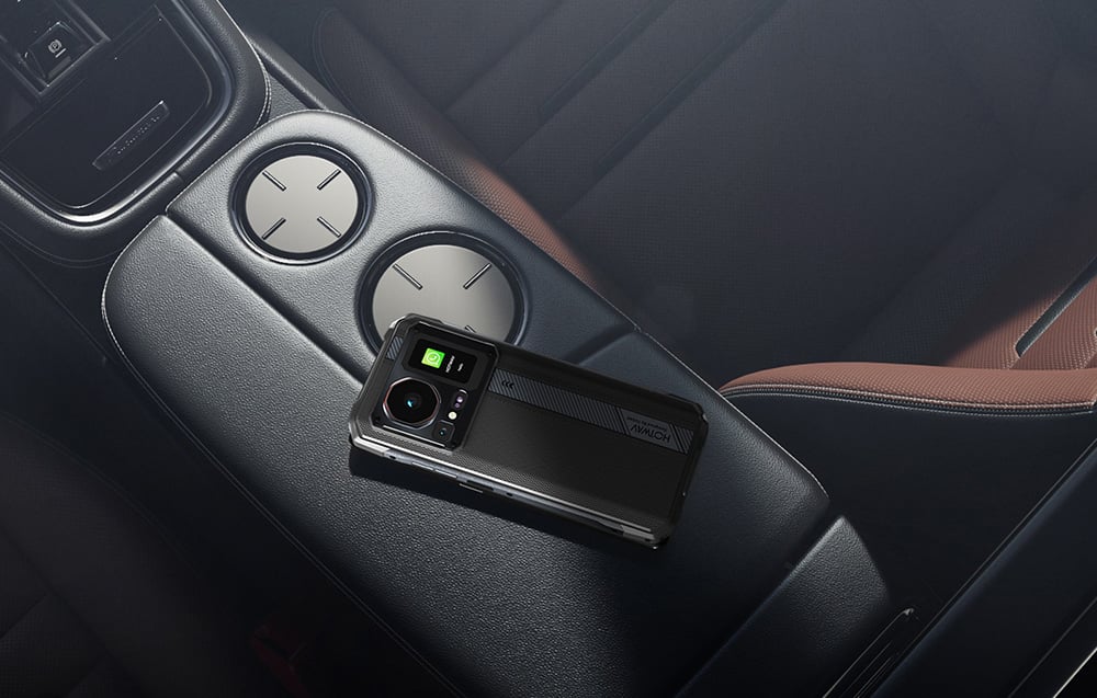 HOTWAV smartphone lying on the armrest inside a luxury car, displaying a WhatsApp notification.
