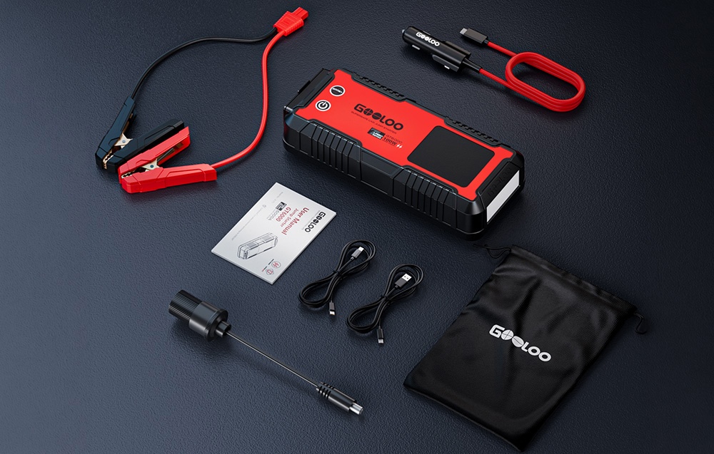 Car jump starter kit with cables, adapters, instructions, and a carrying case