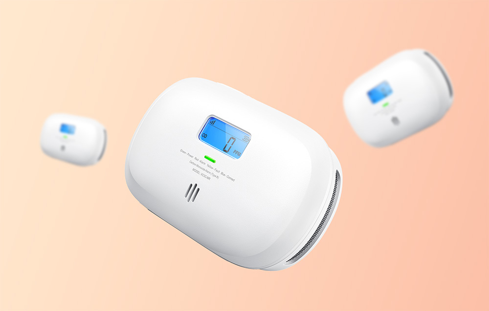 Three white X-Sense carbon monoxide sensors in different shots on a bright orange background