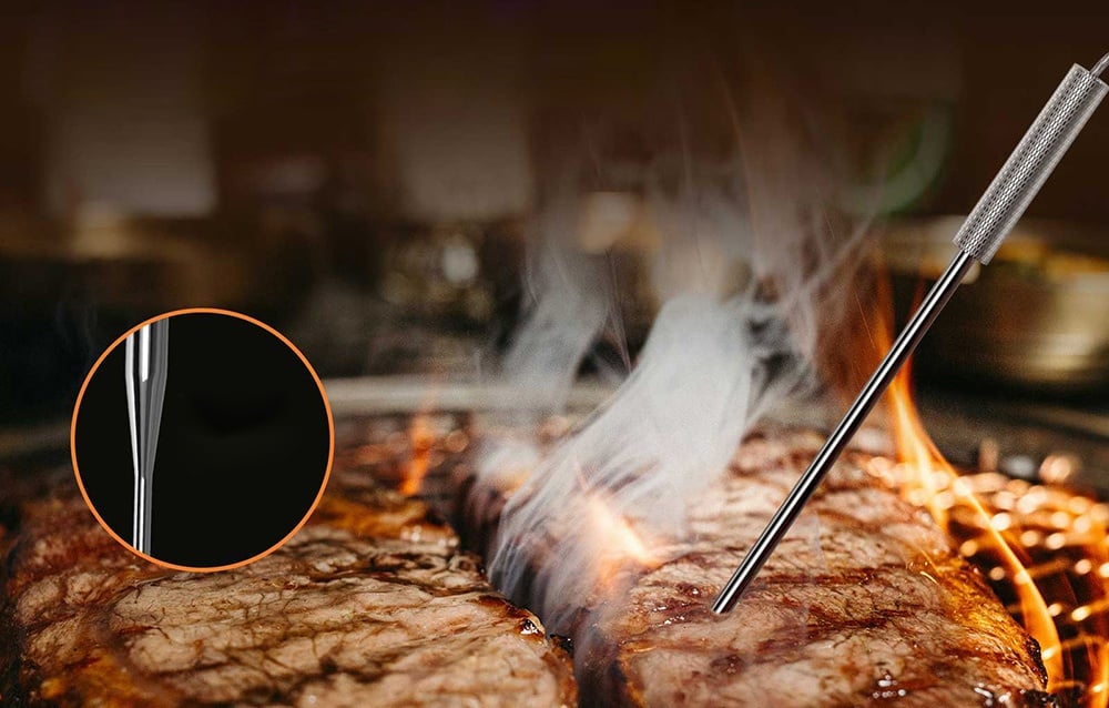 Close-up of the SONOFF MPS01 probe measuring the temperature of meat.