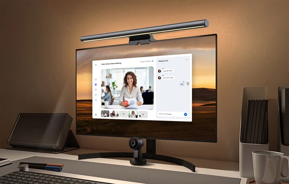 Desktop monitor with Yeelight lighting and webcam; an online meeting is visible on the screen