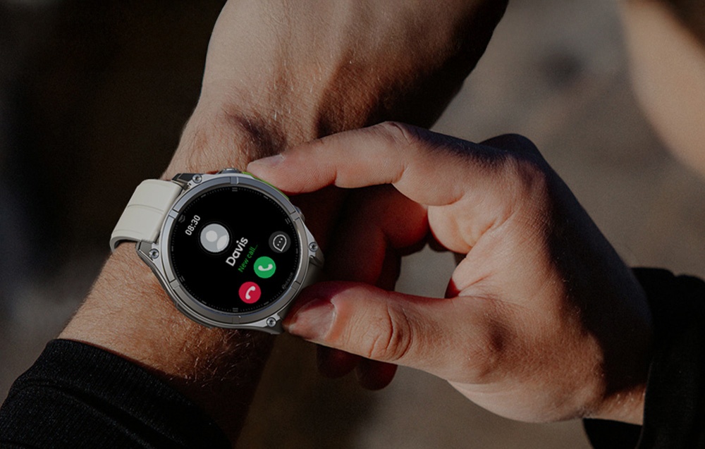 Hand holding smartwatch with white strap, incoming call screen visible on dial
