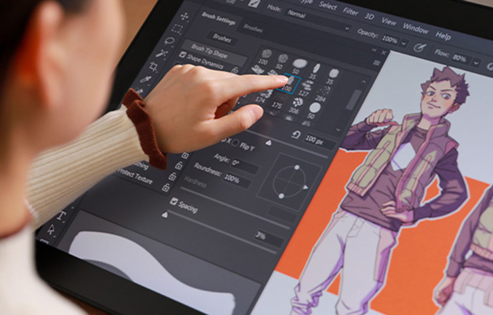 Person selecting brush tool on Huion tablet screen while working on character illustration