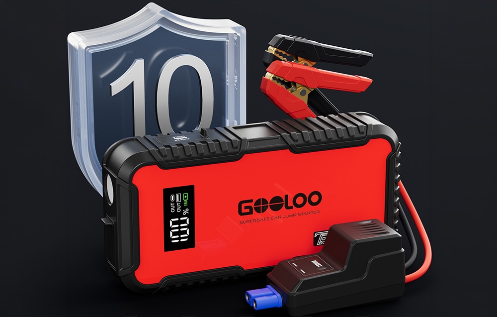 Car starter with terminals and a module connected next to it, against a background of a dial with the number 10