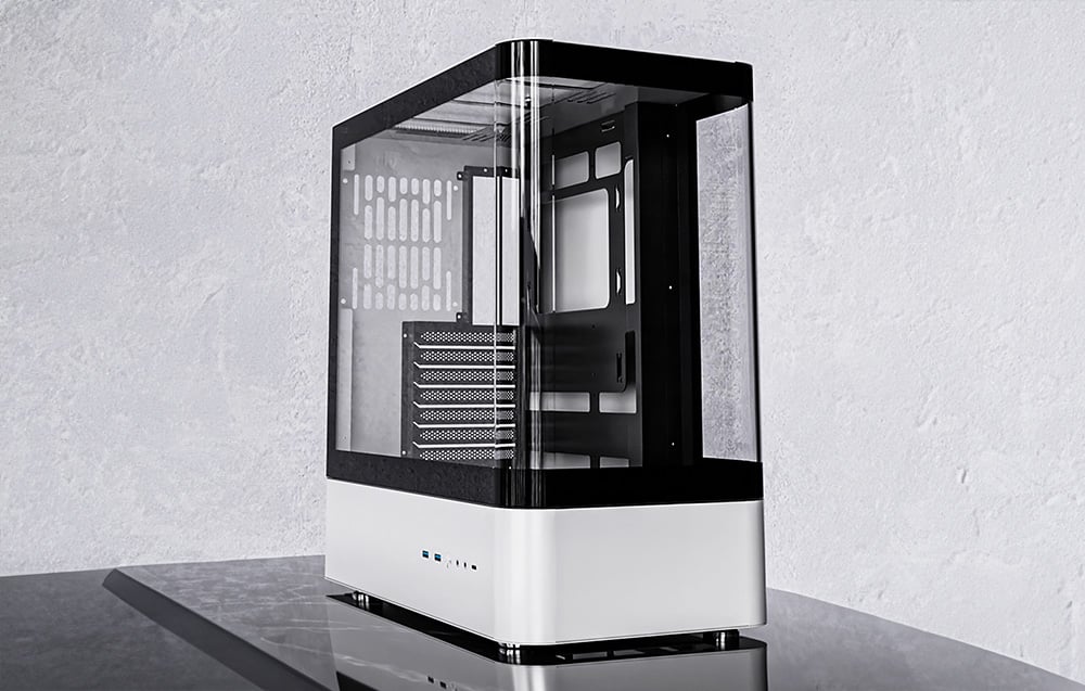 White and black computer case on a stone table top