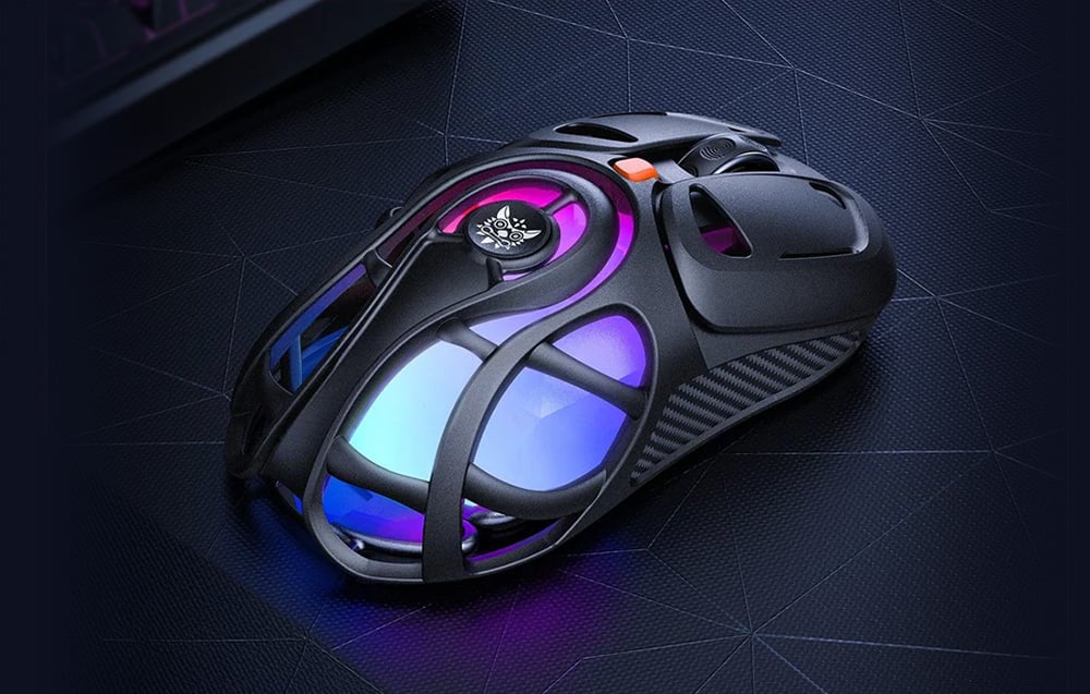 Black gaming mouse with holes and colored backlight on dark background