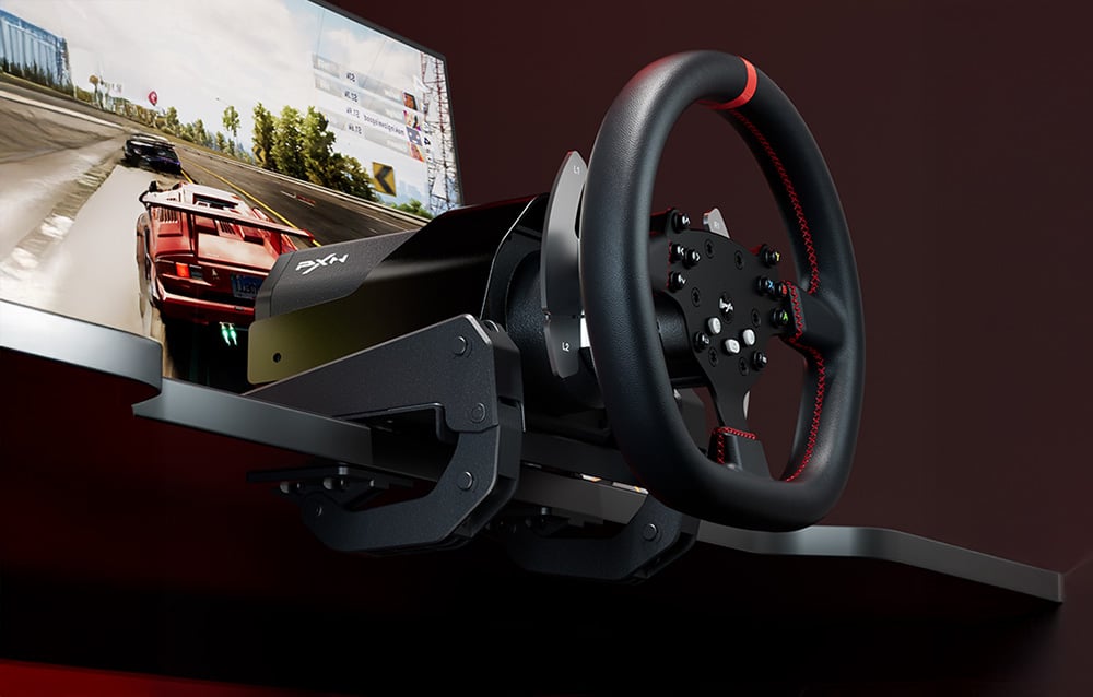 PXN-V10 Pro steering wheel clamped to the desk with a racing game running on the monitor