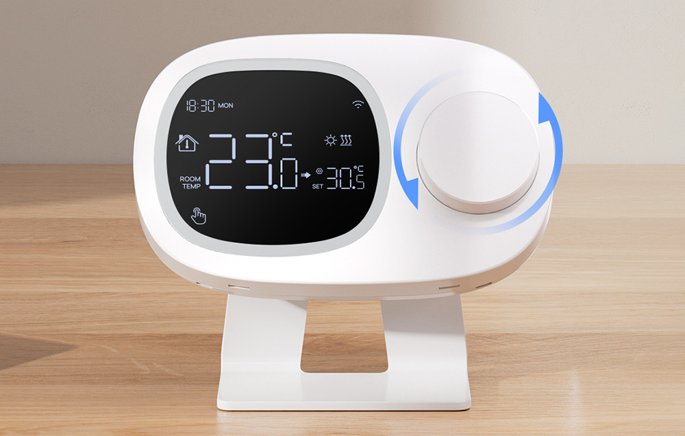 Smart thermostat with display and dial on wooden table