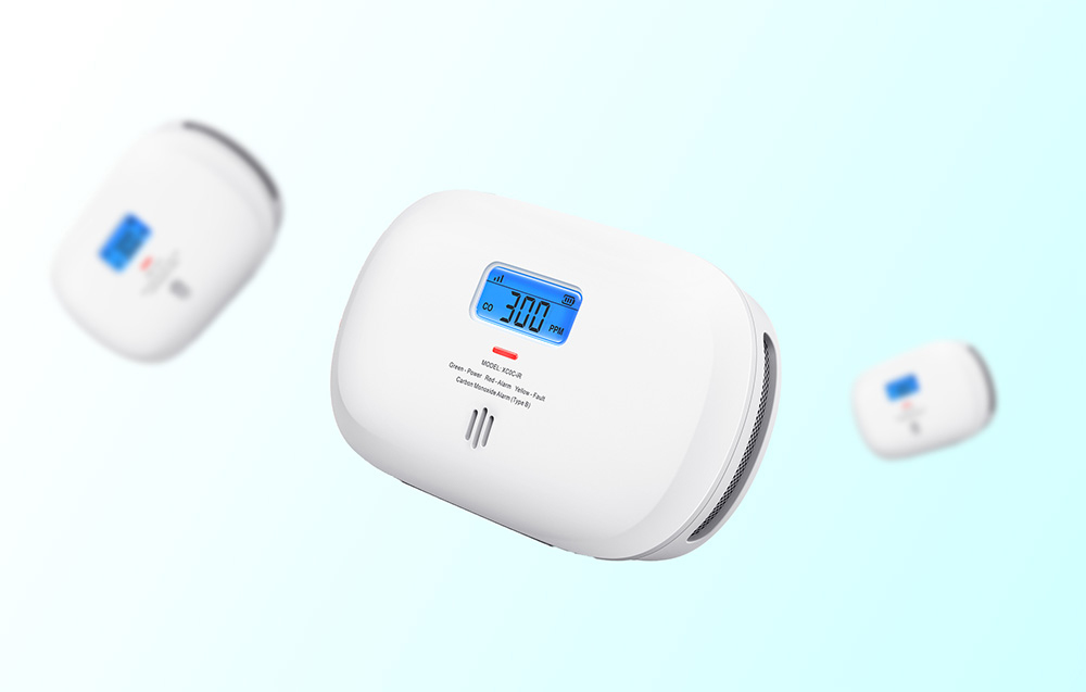 Three carbon monoxide detectors floating on a blue background
