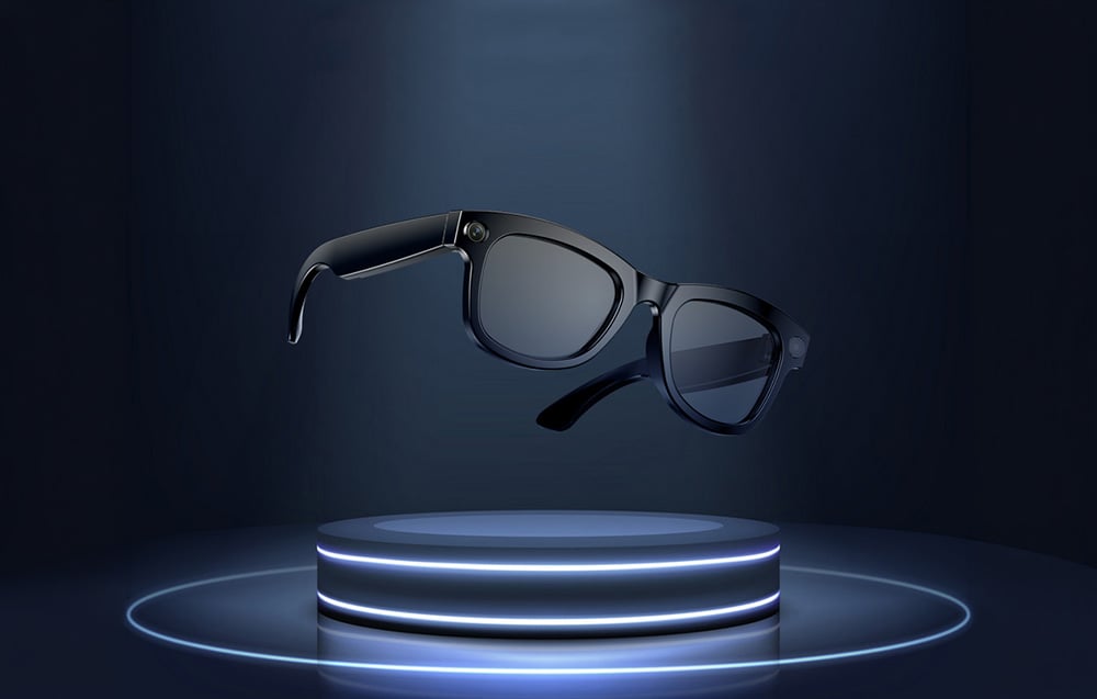 Smart glasses in black frames hover above a blue-lit podium