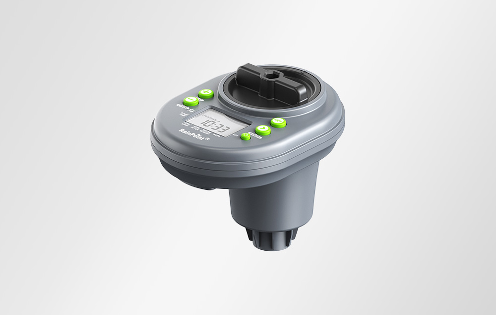 Gray RainPoint irrigation controller with green buttons and a display, shown in a three-quarter view
