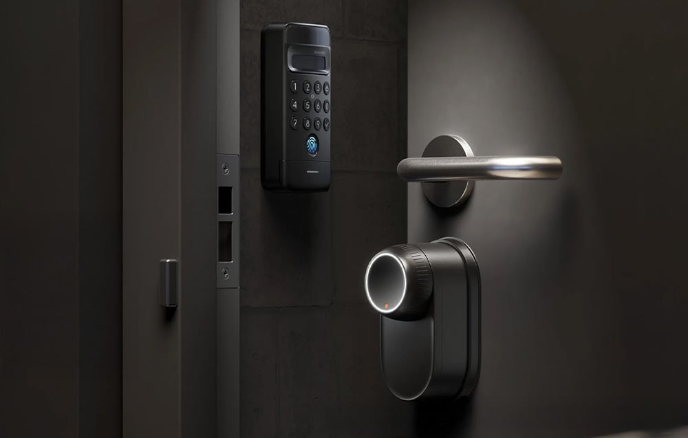 Dark gray door with SwitchBot lock, keypad with fingerprint reader, metal handle and insert lock