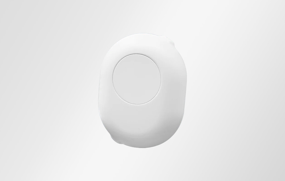 Shelly controller accessory in white with a bright background.