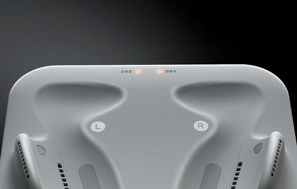 Close-up of the BoboVR CD3 station with L and R markings and two glowing LEDs