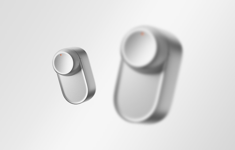 Minimalist composition of two silver SwitchBot locks with orange LEDs, one smudged