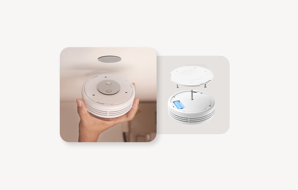 Two images showing the bottom of a smoke detector with mounting magnets and a diagram of the device’s interior with a battery