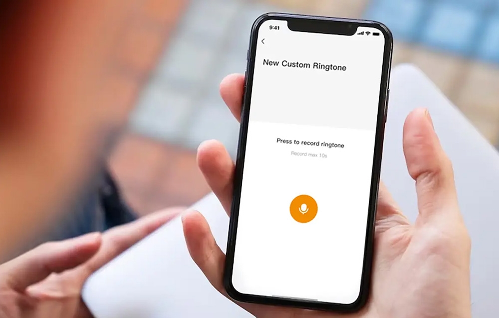 A hand holding a smartphone with a