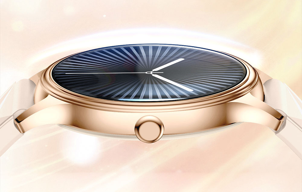 Side view of the thin case of a gold smartwatch with convex glass and a classic side button.