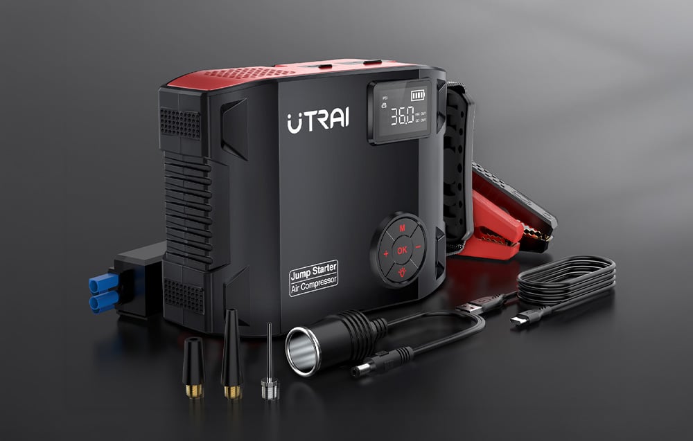 Car jump starter with an accessory kit, including cables with clamps and interchangeable nozzles.