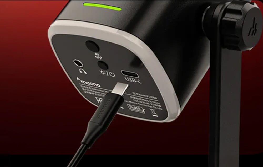 Close-up of the bottom panel of the Maono microphone with a connected USB-C cable and visible ports