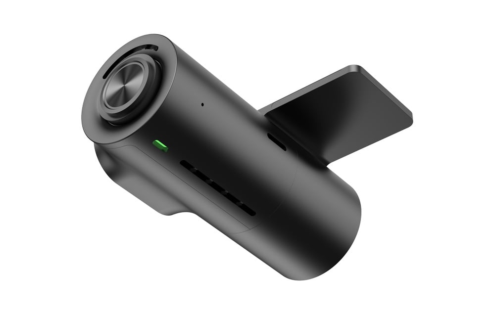 Black dashcam viewed from below; visible memory card slot and glowing green LED